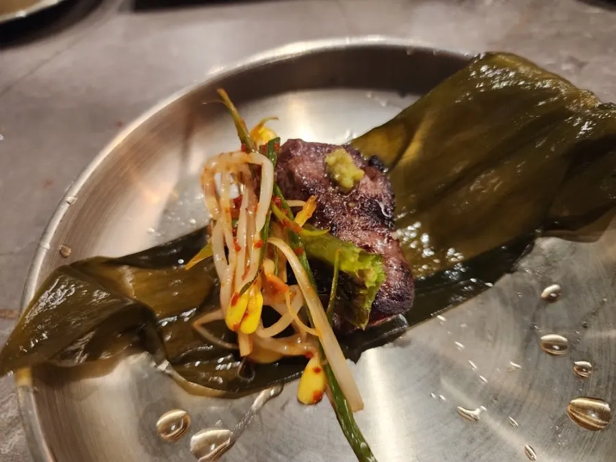 Surface of hanwoo beef grilling over charcoal