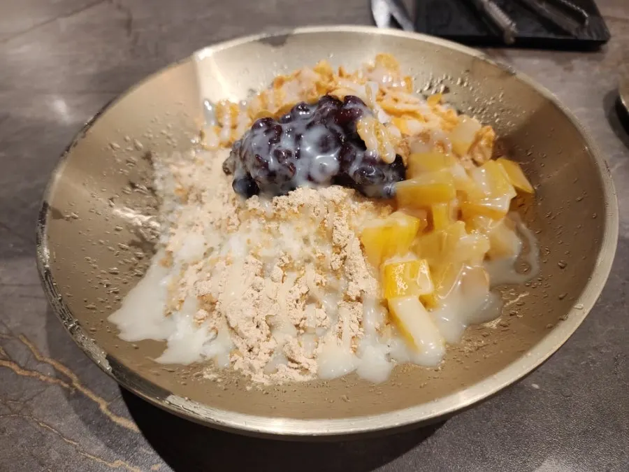 A spoonful of doenjang sulbap lifted up