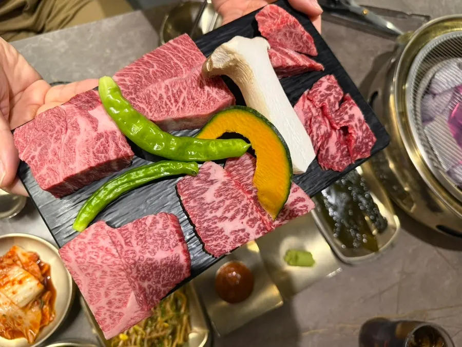 Hanwoo platter grilling on the tabletop stove