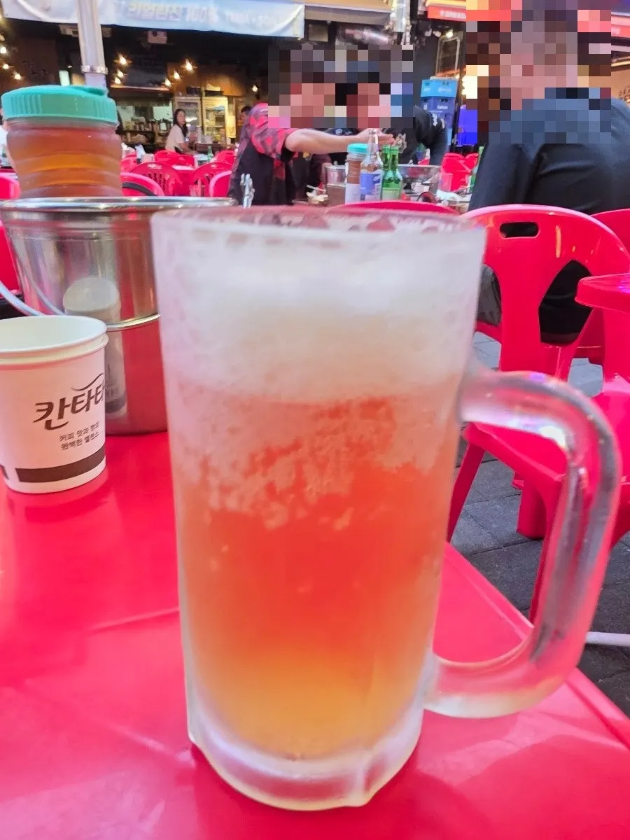 Snack plate next to a beer glass
