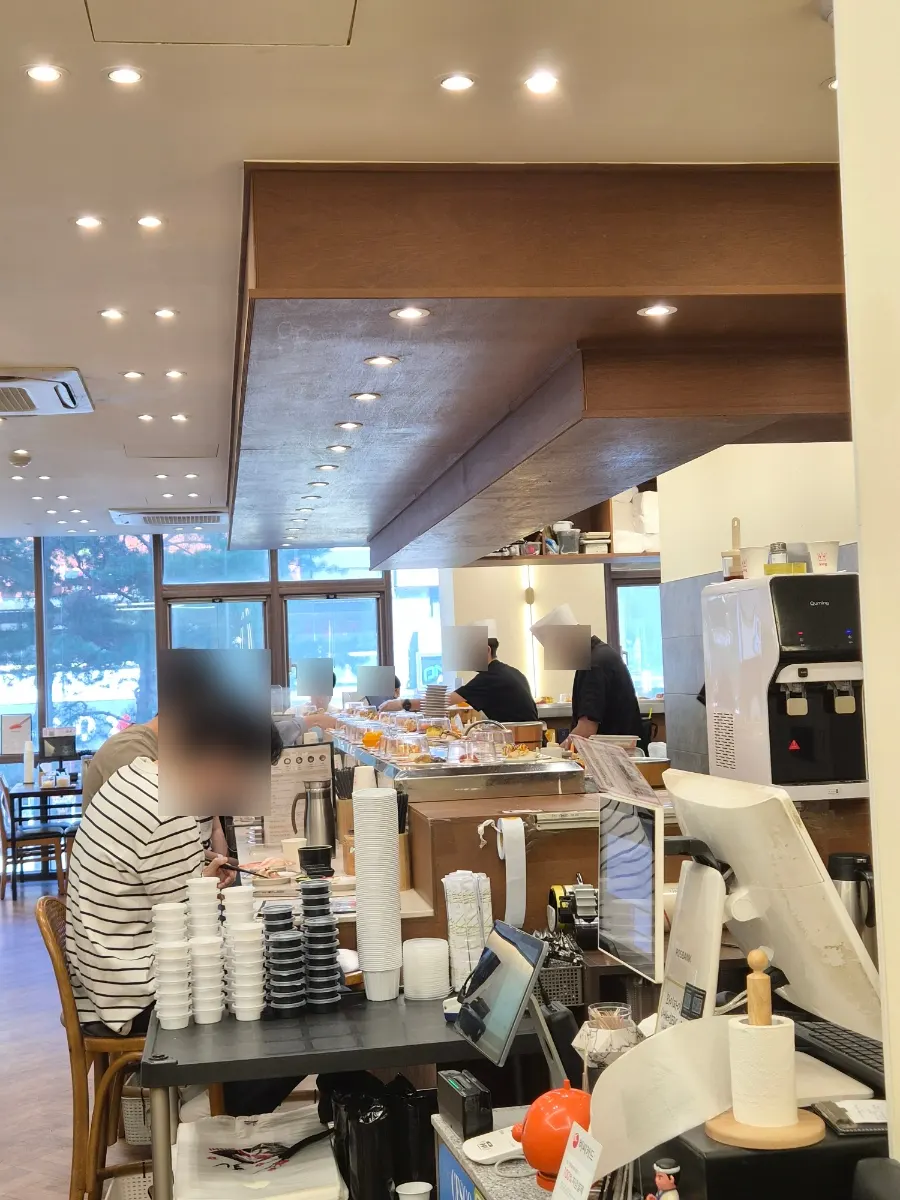 Bar tables set along the conveyor-belt sushi rail
