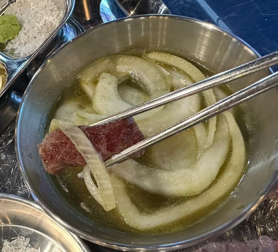 Beef grilling on the pan