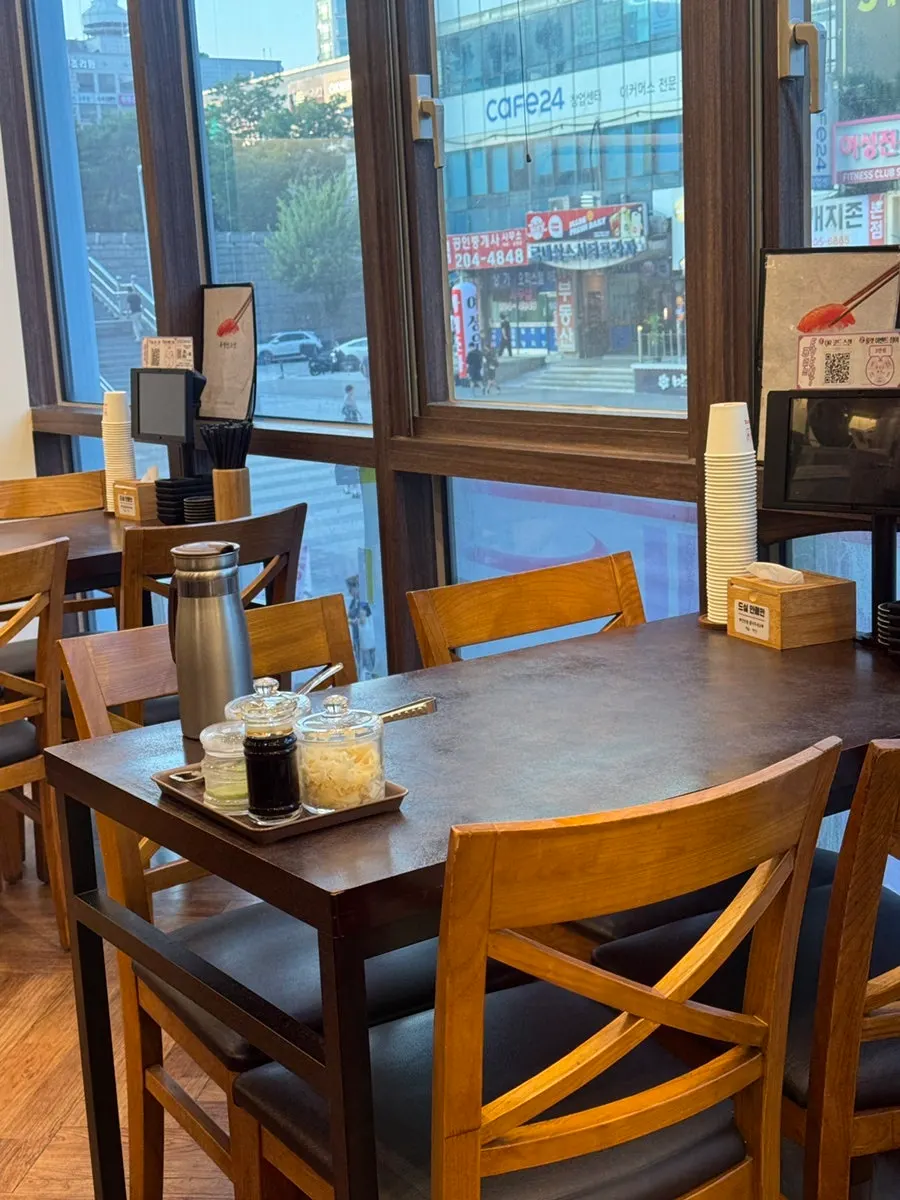 Interior view with bar seats and conveyor belt