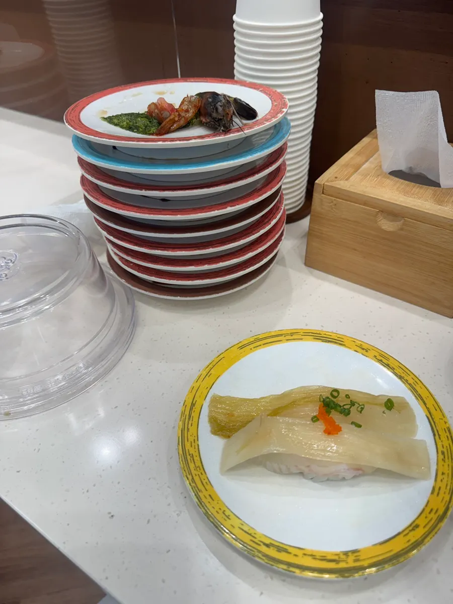Stacked empty plates from solo dining