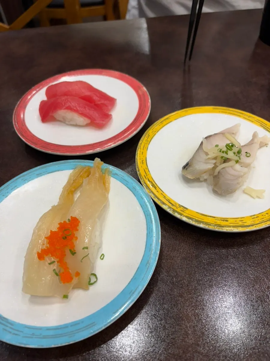 Several plates of different sushi on the table