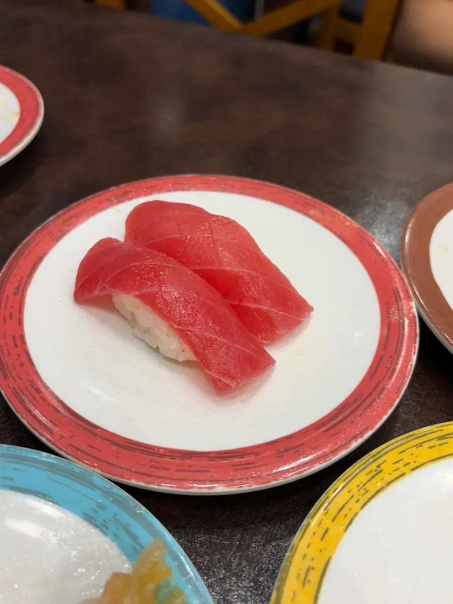 Stacked sushi plates ordered by two people
