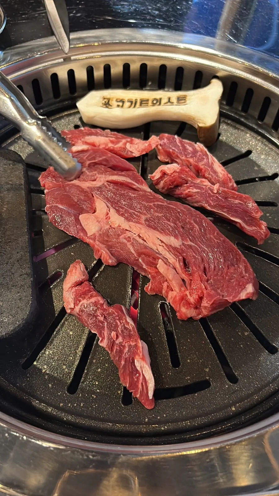 Beef platter grilling on the grate