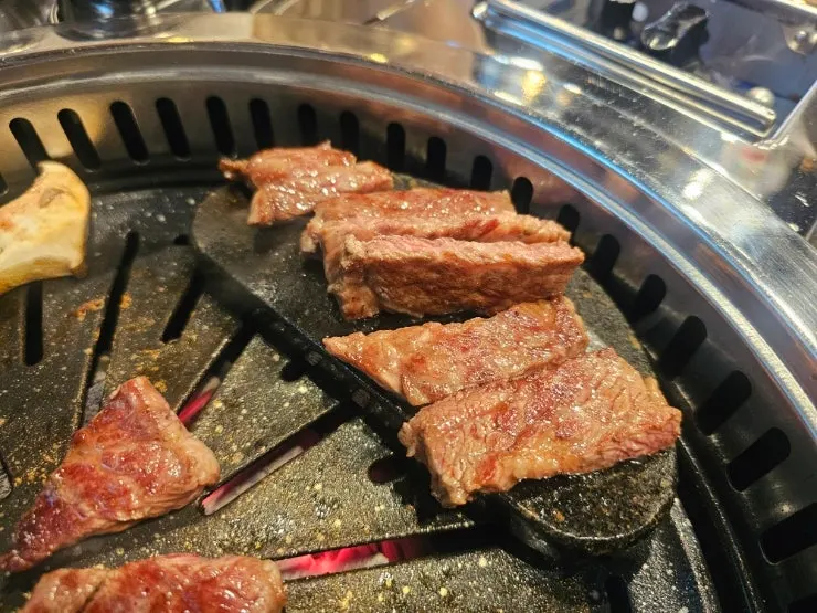 Chuck flap and neck chain cooking on the grill