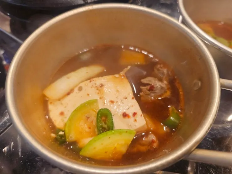 Doenjang jjigae served with a heaping bowl of rice