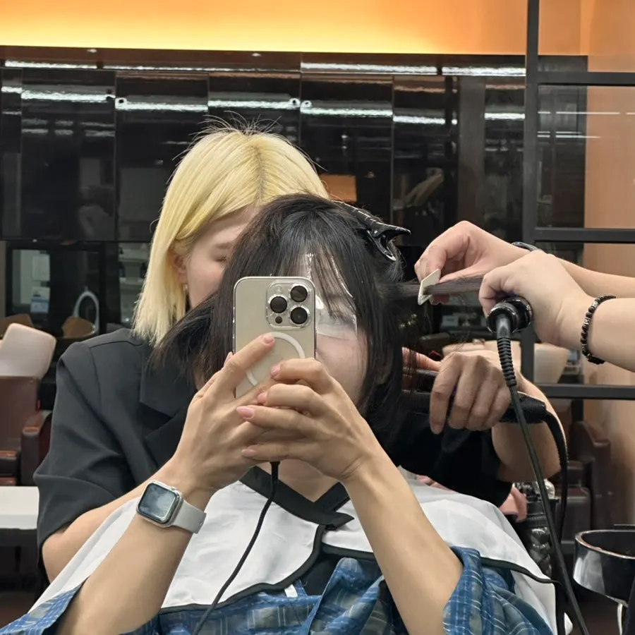 Hair neatened by the cut and volume perm