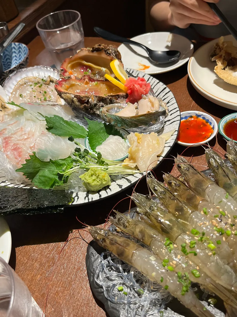 Live sweet shrimp sashimi served on a plate, still moving