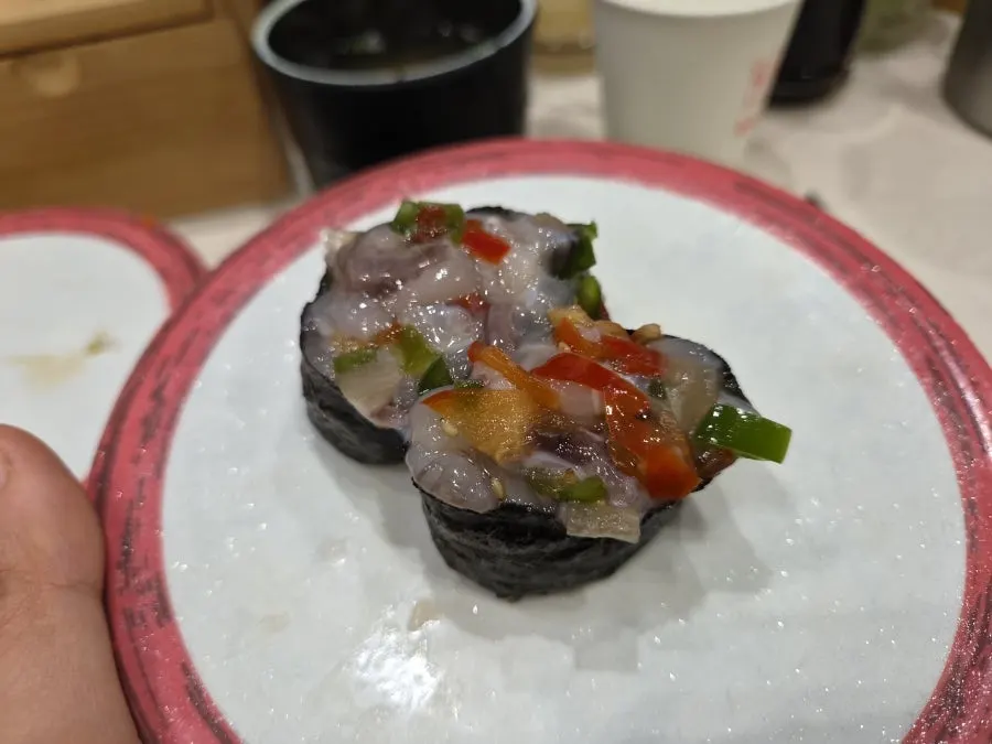 A plate of aged kimchi octopus sushi