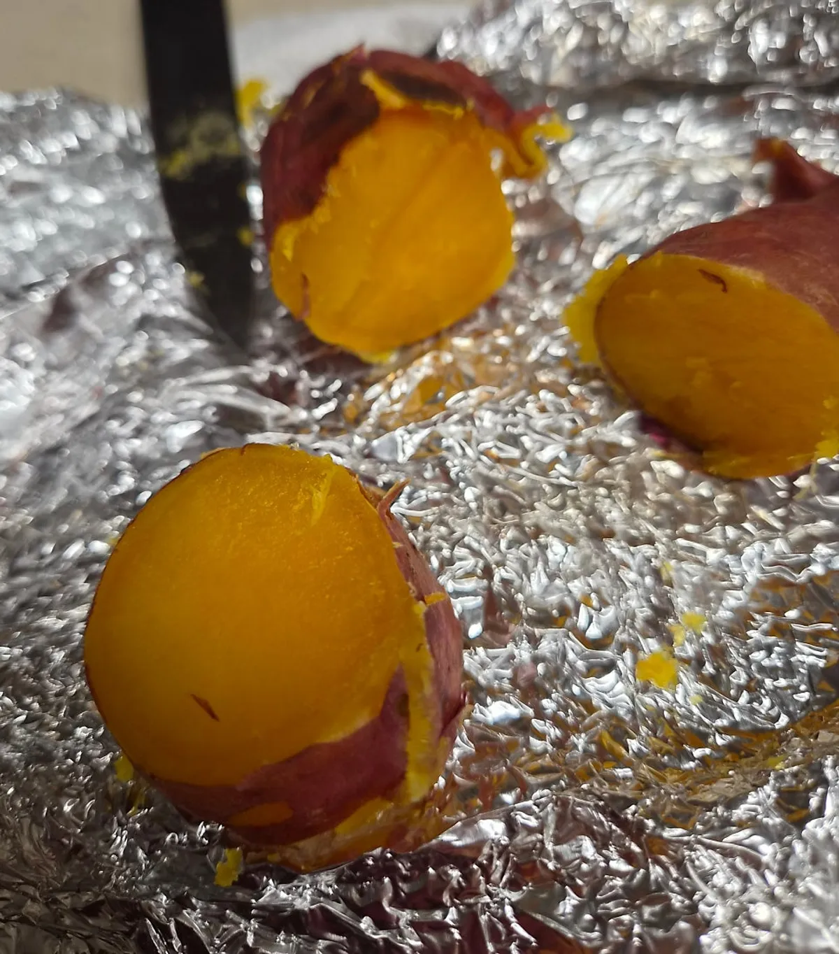 Roasted sweet potatoes cooked over charcoal