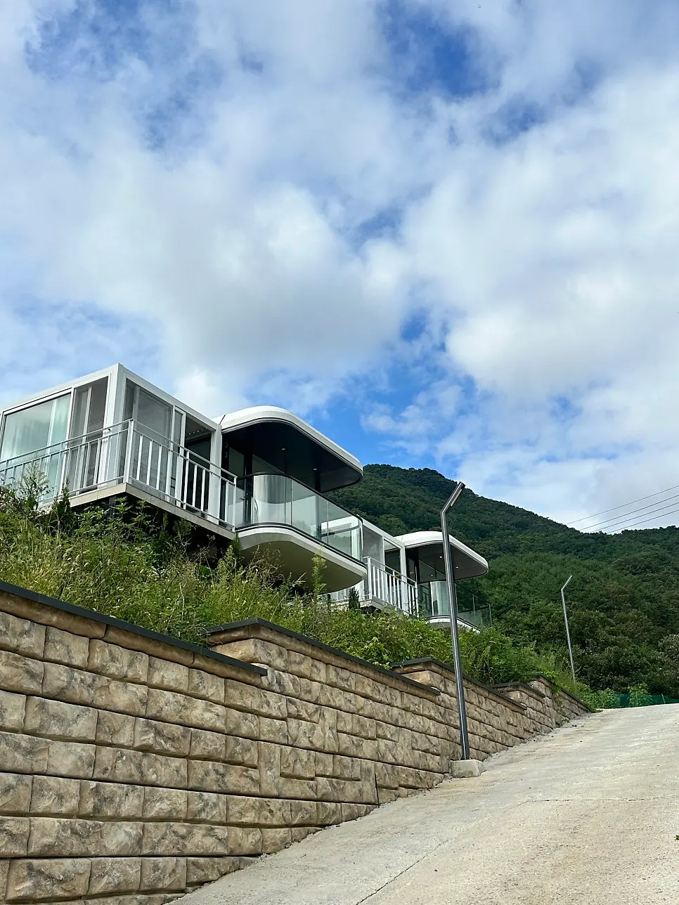 Rounded, elongated private-unit exterior resembling a caravan