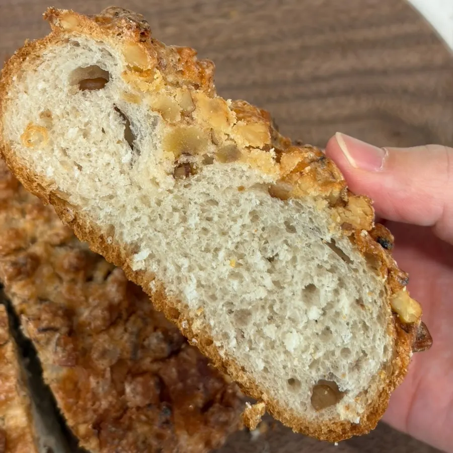 Walnut bread topped generously with walnuts and crumb topping