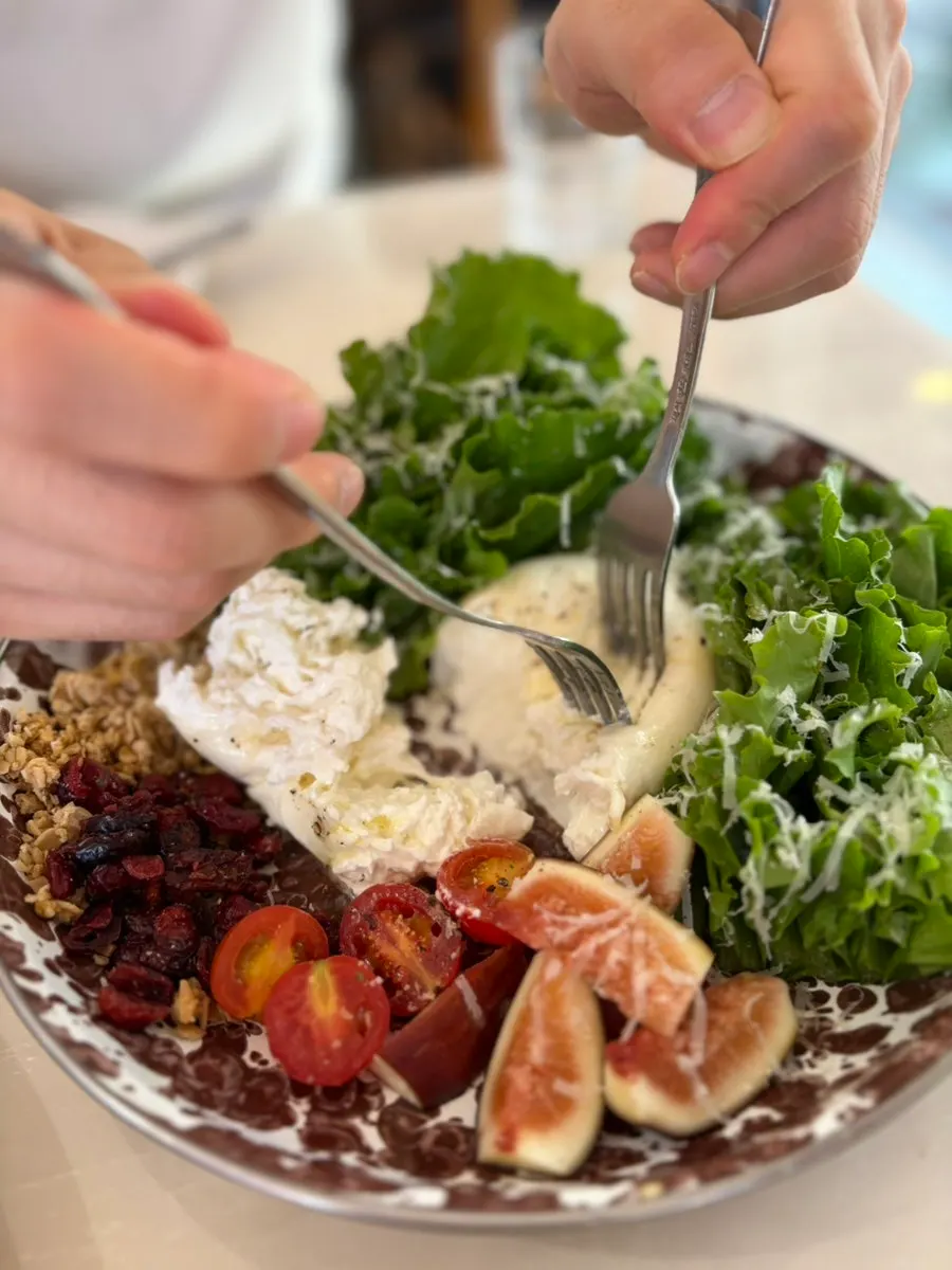 Salad with burrata cheese and romaine lettuce