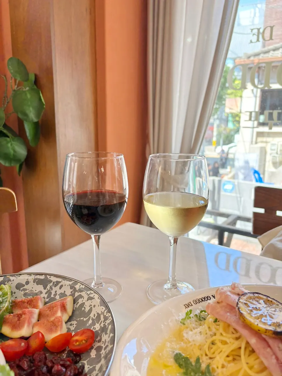 Glasses of white and red wine served with the meal