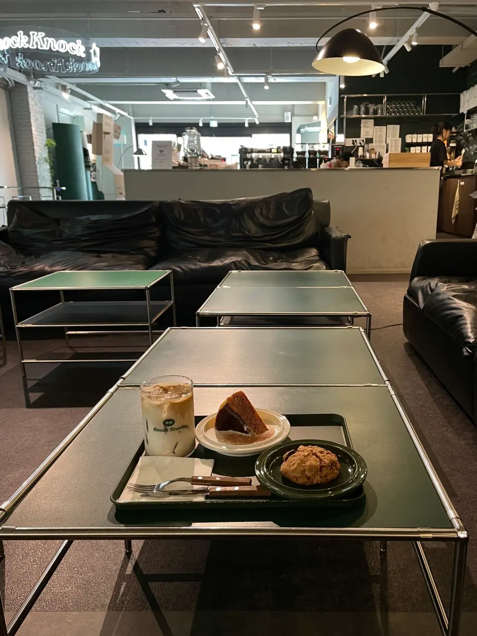 Solo table setting with latte and dessert