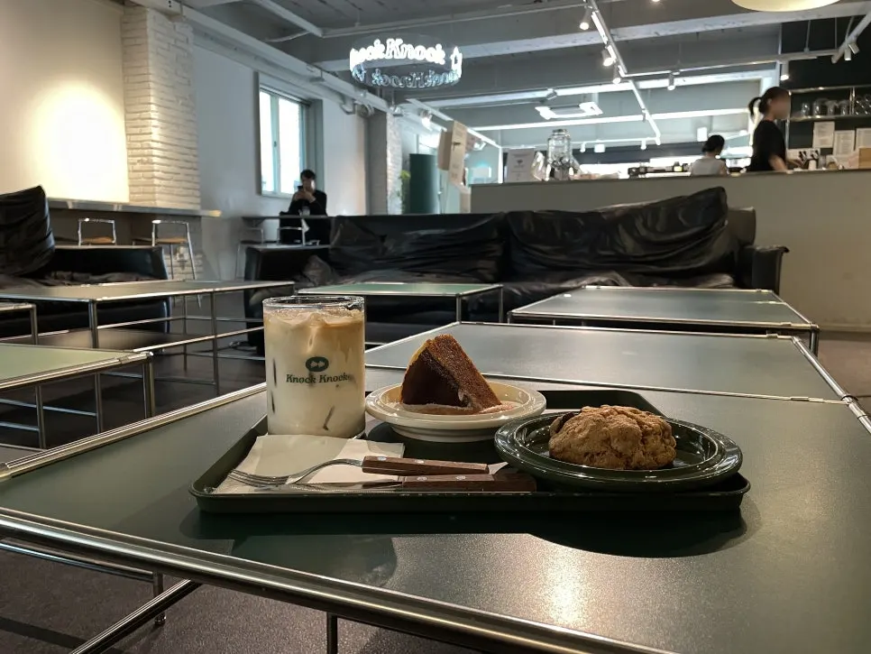 Caffe latte and two desserts on the table