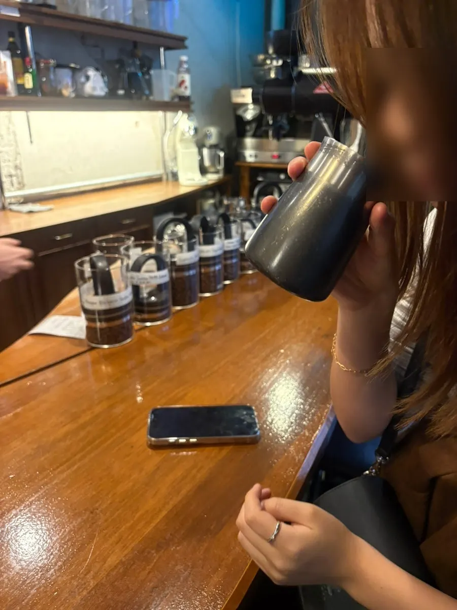Barista performing the drip extraction process at the 1st-floor bar
