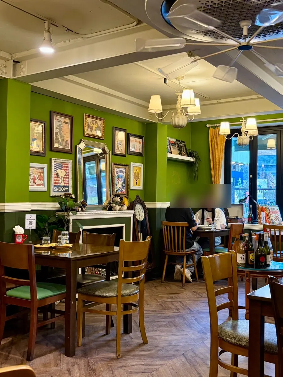 Antique-atmosphere dining hall seating at Hey Joji