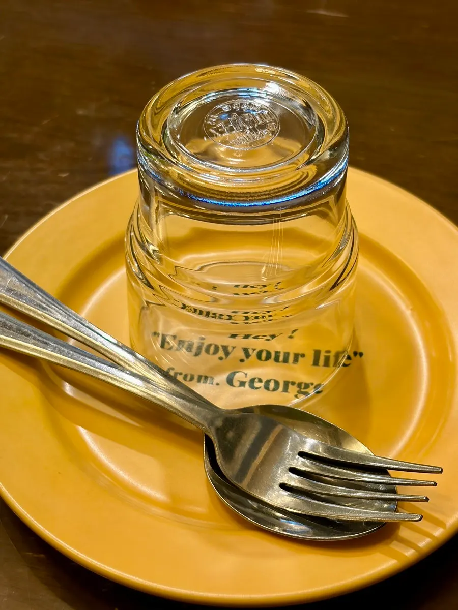 Yellow plate and cutlery set on the table