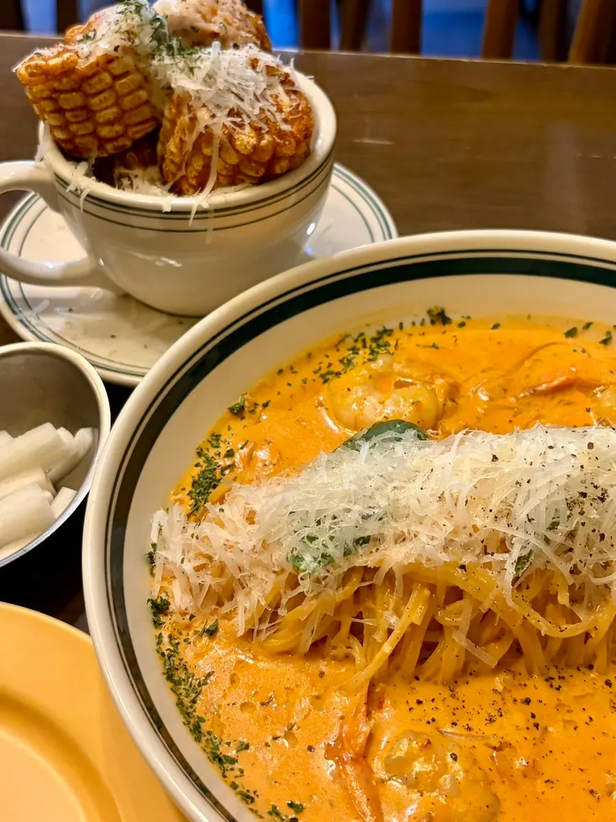 Rosé pasta and corn ribs served together at once