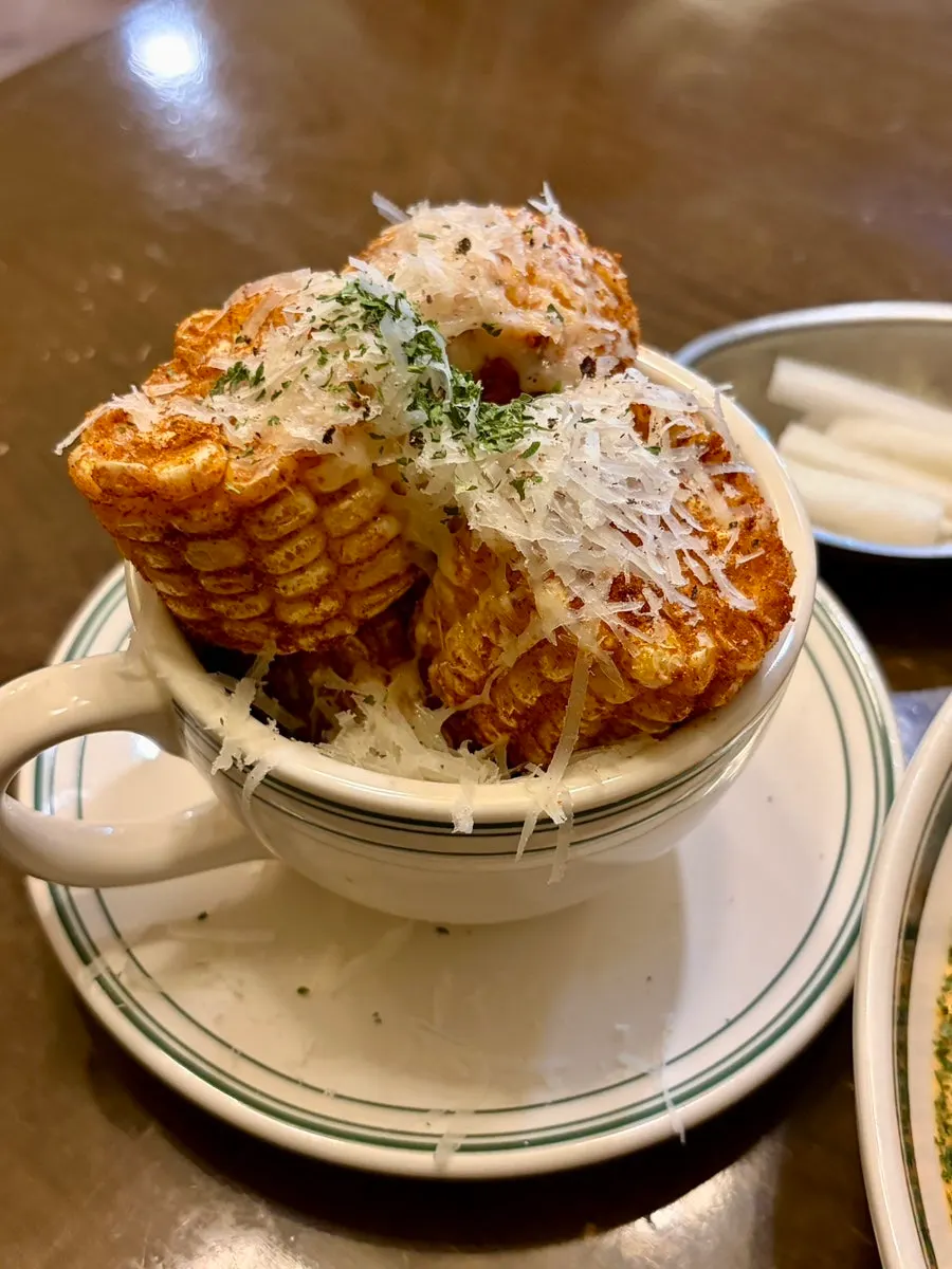 Hey Joji's corn ribs topped with cheese