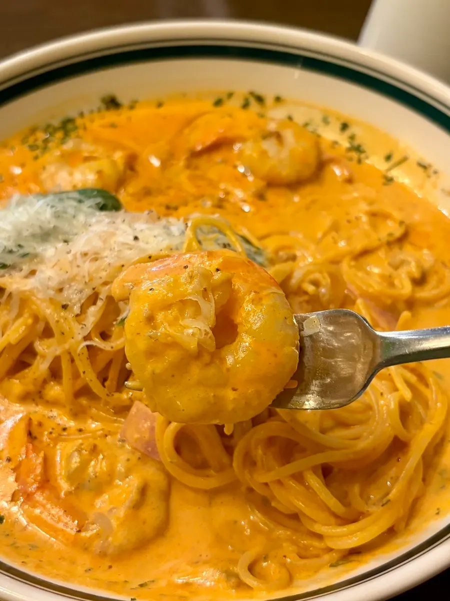 Rosé pasta topped with hefty shrimp