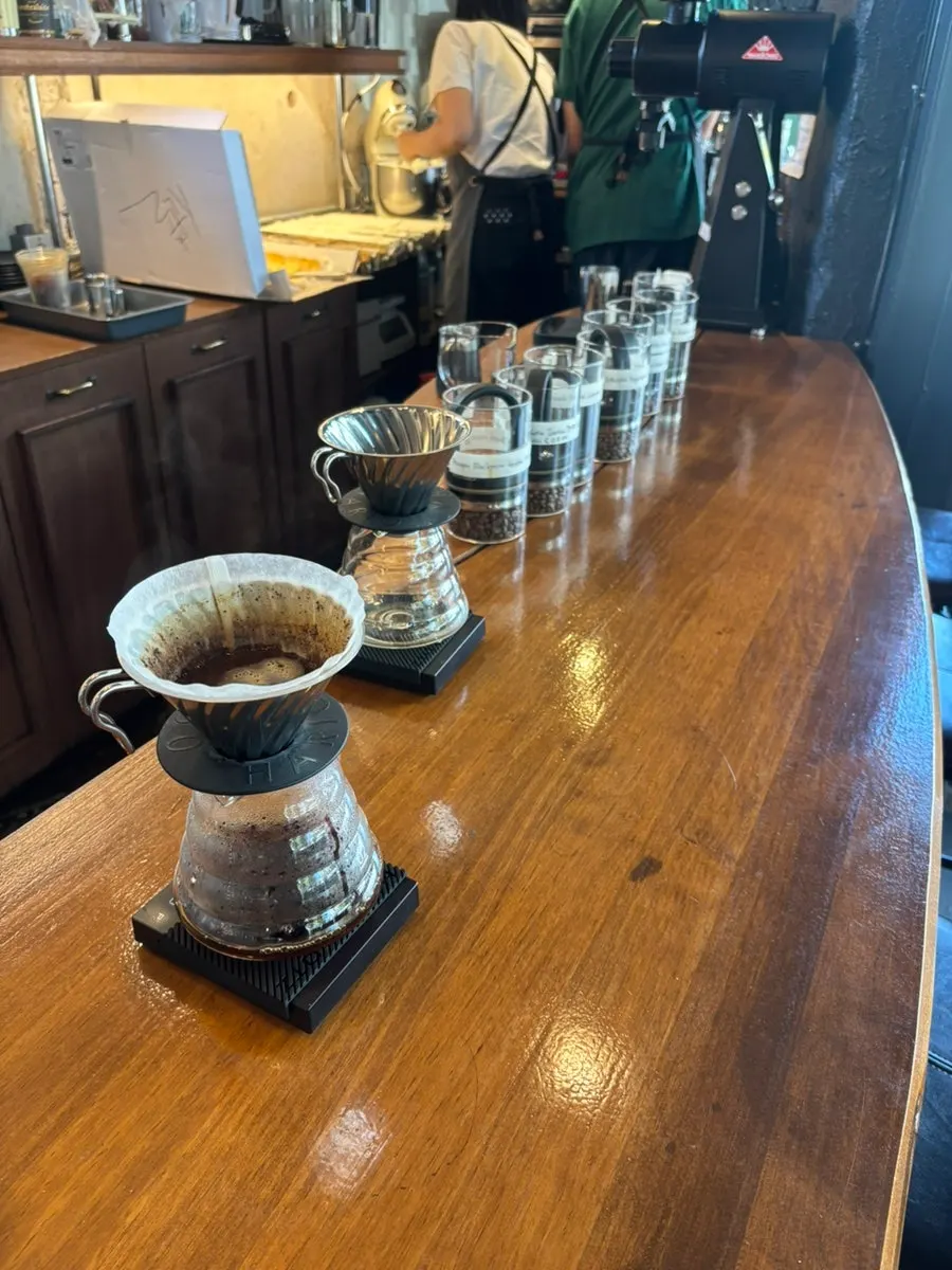 The hand-drip extraction process visible from the bar seat
