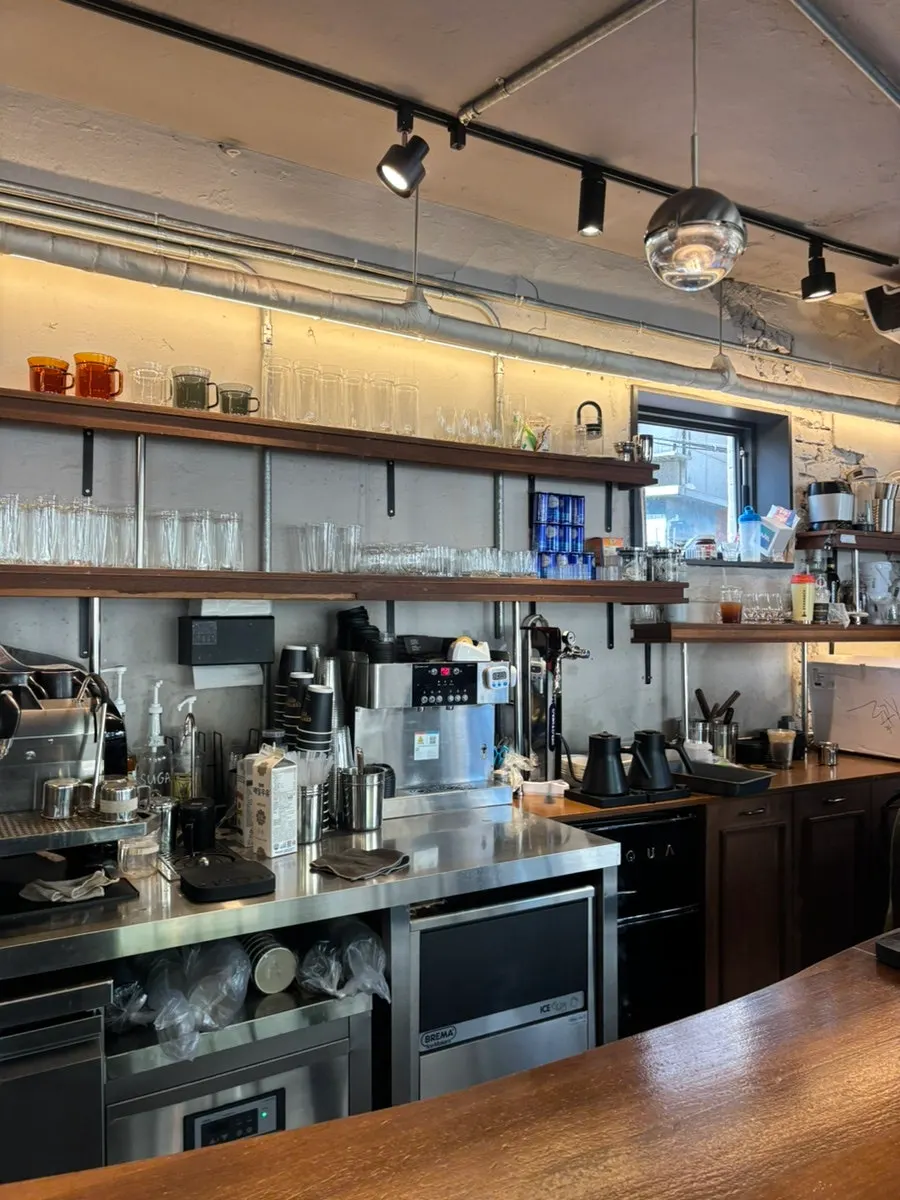A glass of iced drip coffee set on the bar table