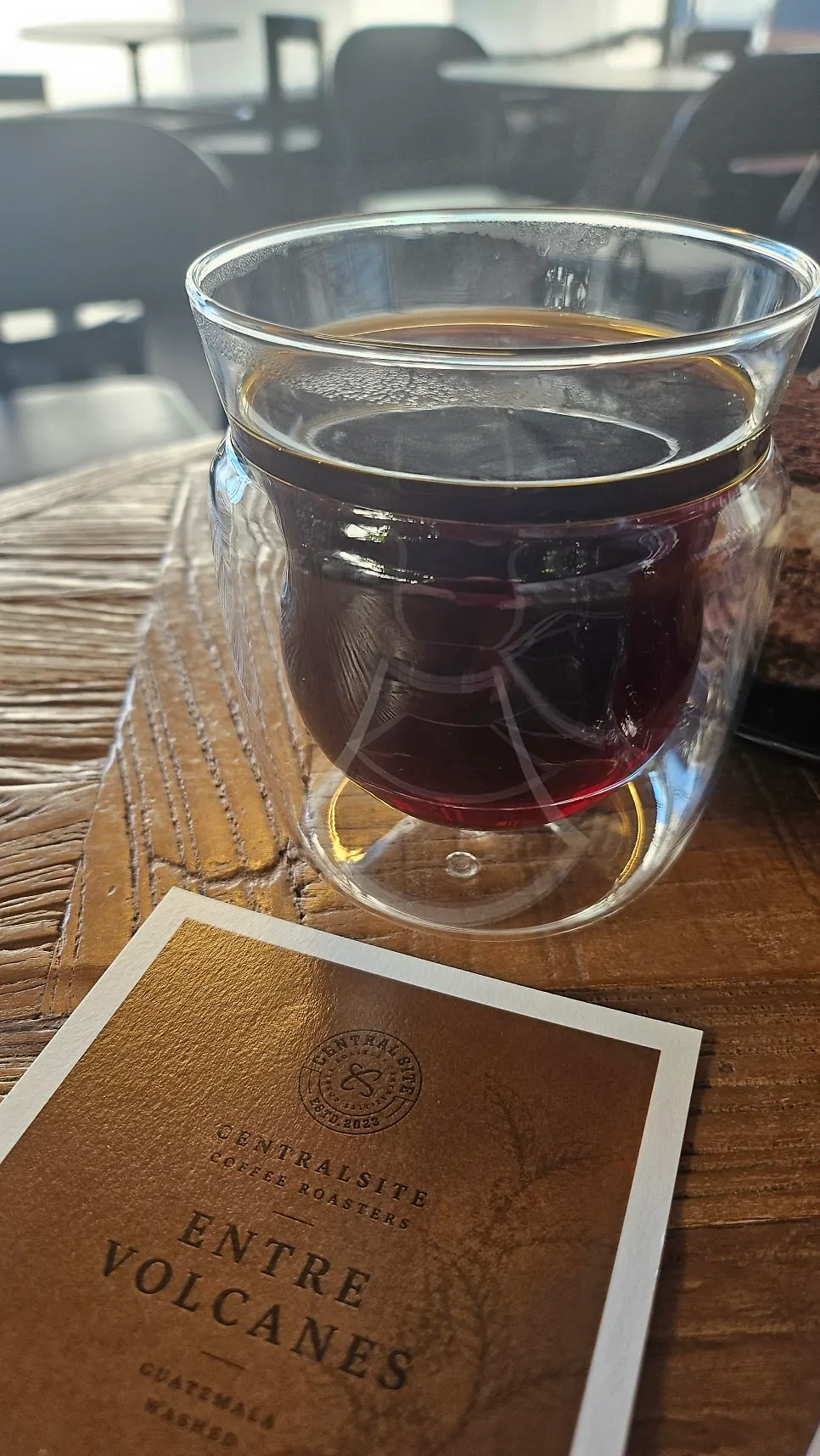 Two cups of brewed coffee and classic tiramisu on the table