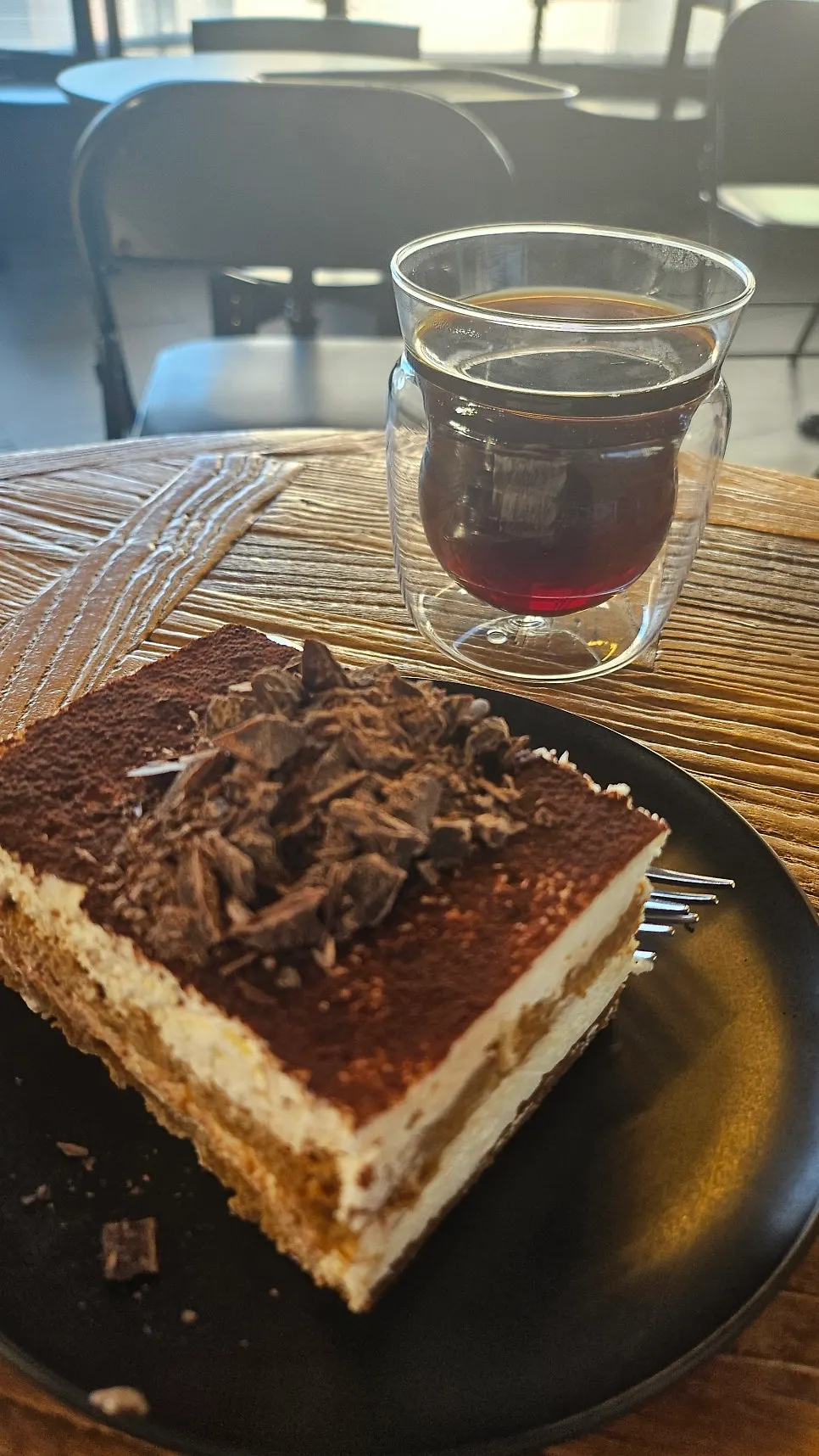 Cross-section of the classic tiramisu with a spoonful taken out