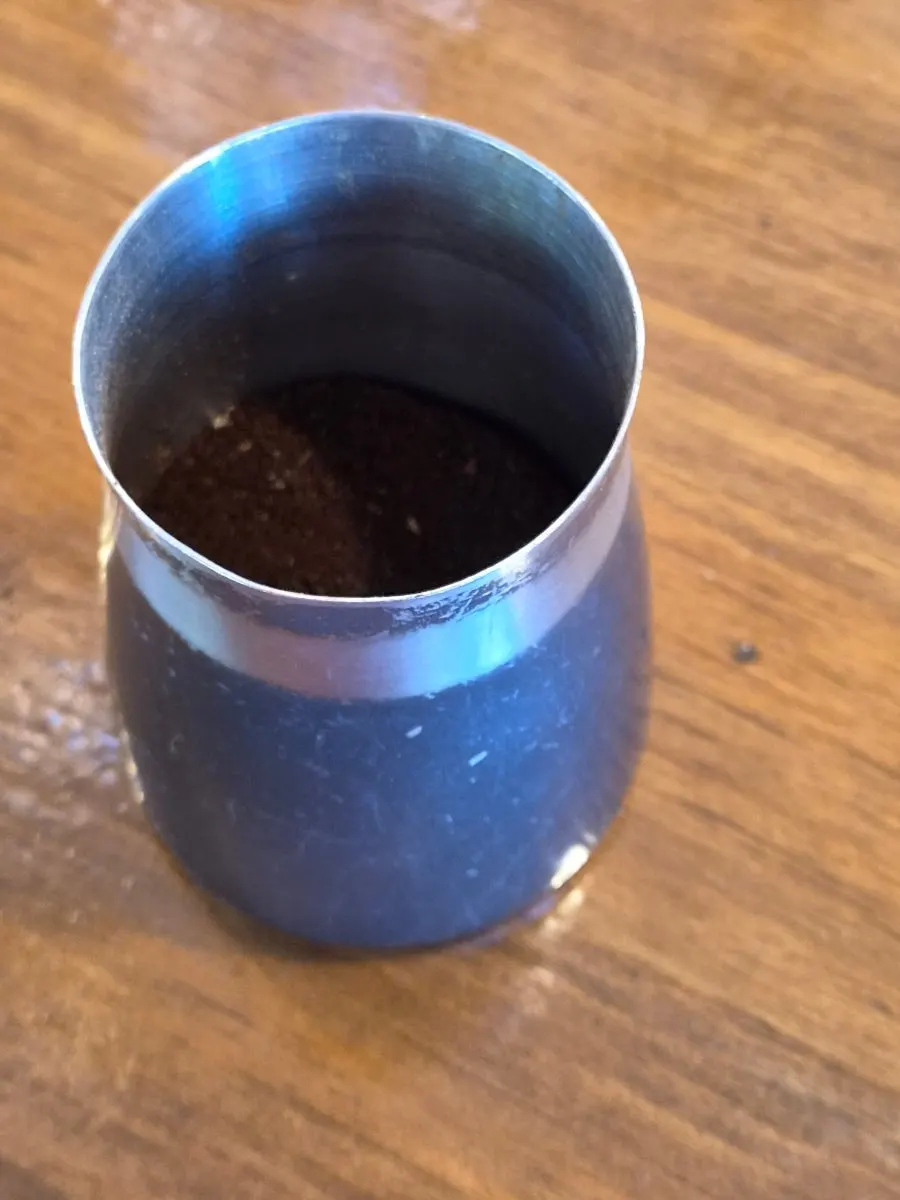 Grinding beans at the 1st floor bar