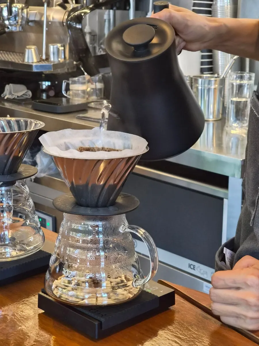 Hand-drip extraction being poured right in front of you