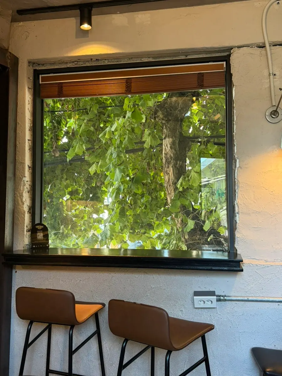Tables and bar seating on the second floor of Central Site Yeonnam