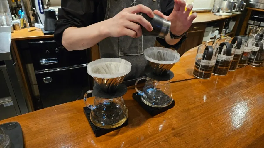 Grinding beans as part of the brewing process