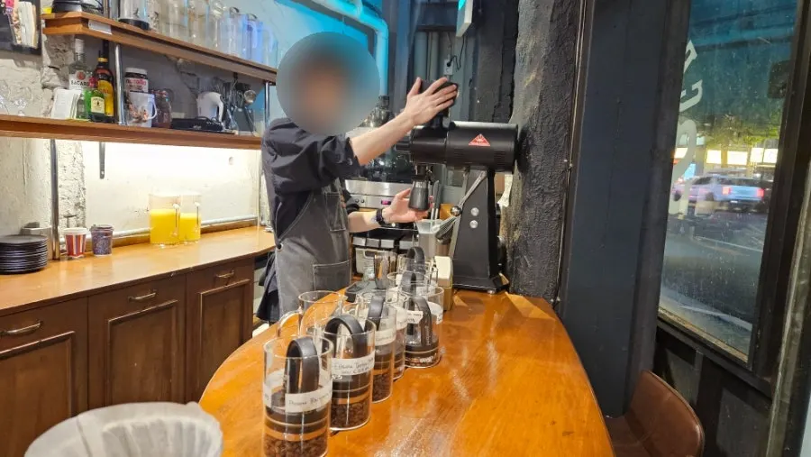 Brewing coffee served with a description card for the chosen bean