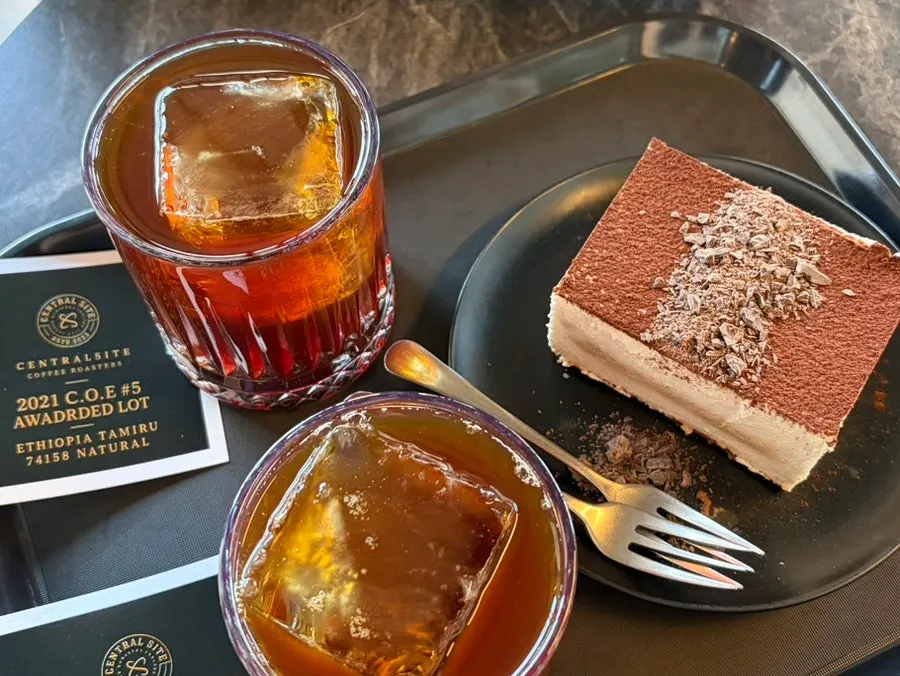 Drip coffee and tiramisu at the window table