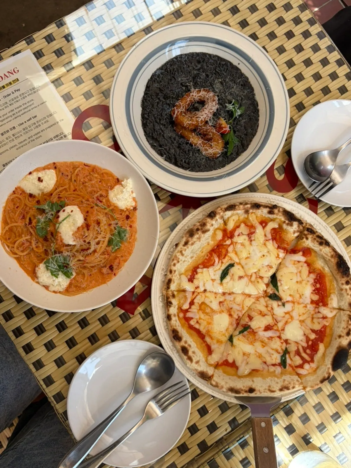 Table at Classicdang with pizza, pasta, and risotto together