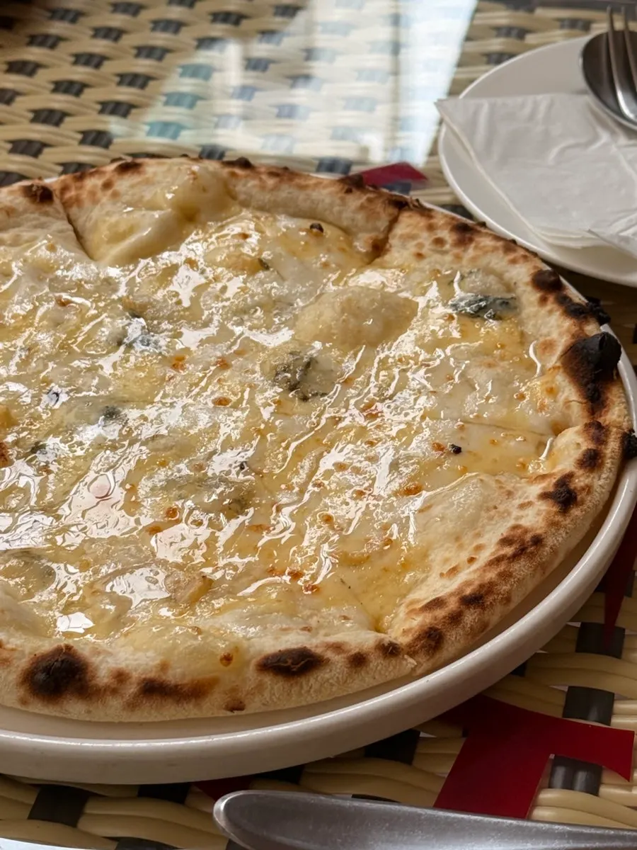 Gorgonzola cheese pizza served drizzled with honey