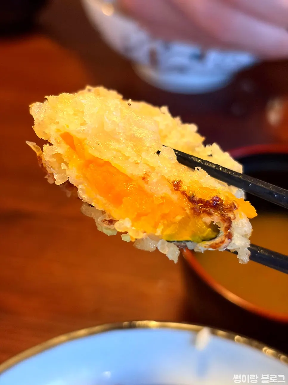 A bite of tendon with rice