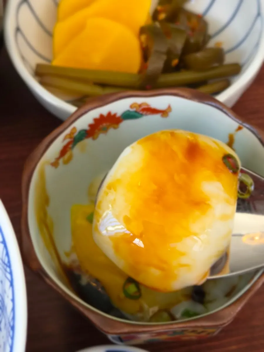 Onsen tamago placed beside the rice bowl
