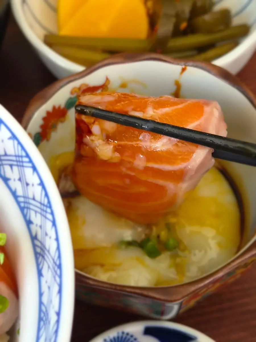 A spoonful of the rice bowl mixed with onsen tamago