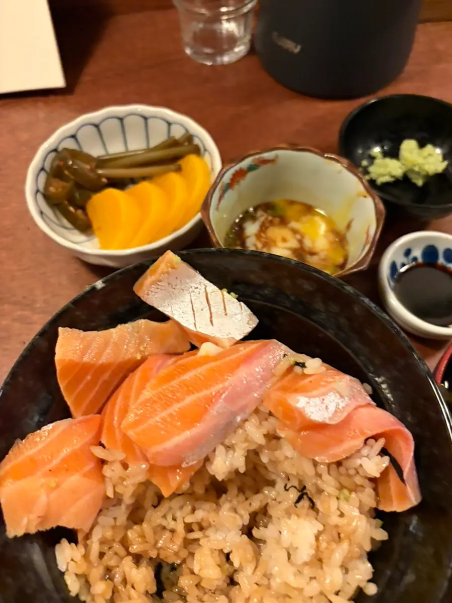 A bowl of salmon belly rice bowl with onsen tamago