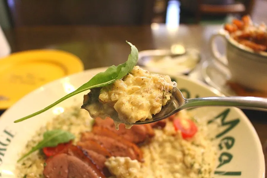 Risotto topped with a thick duck steak