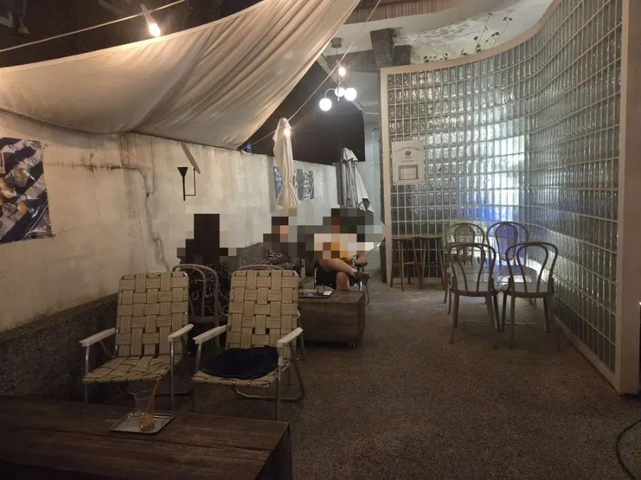 Lit-up terrace seating at Pip Espresso Bar