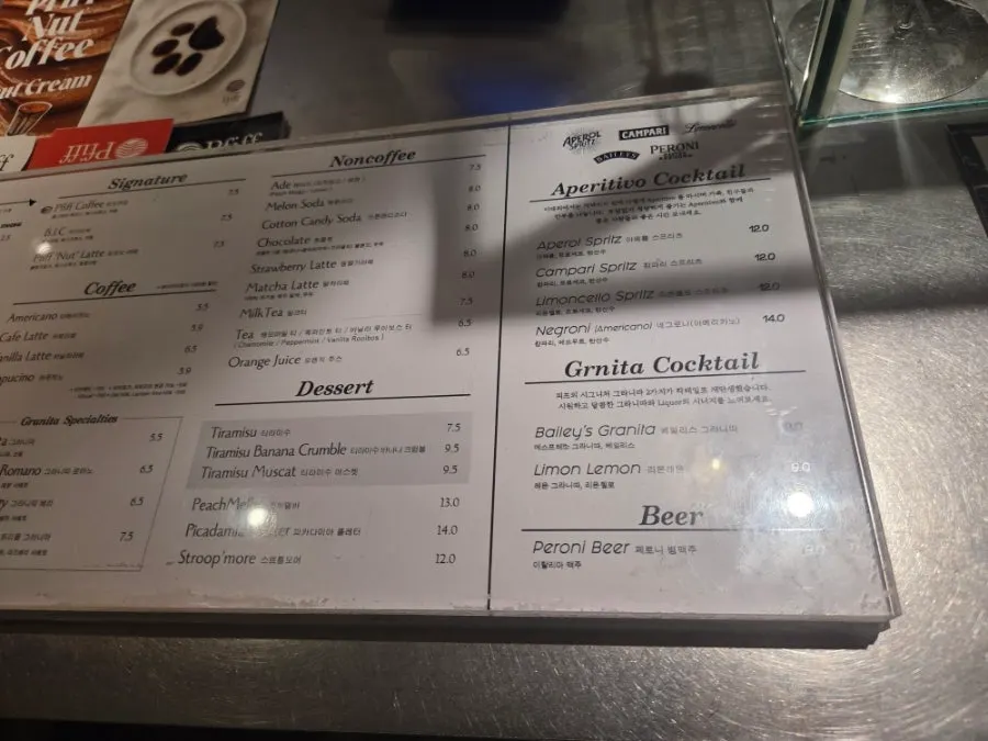 Menu board listing non-coffee drinks and alcohol