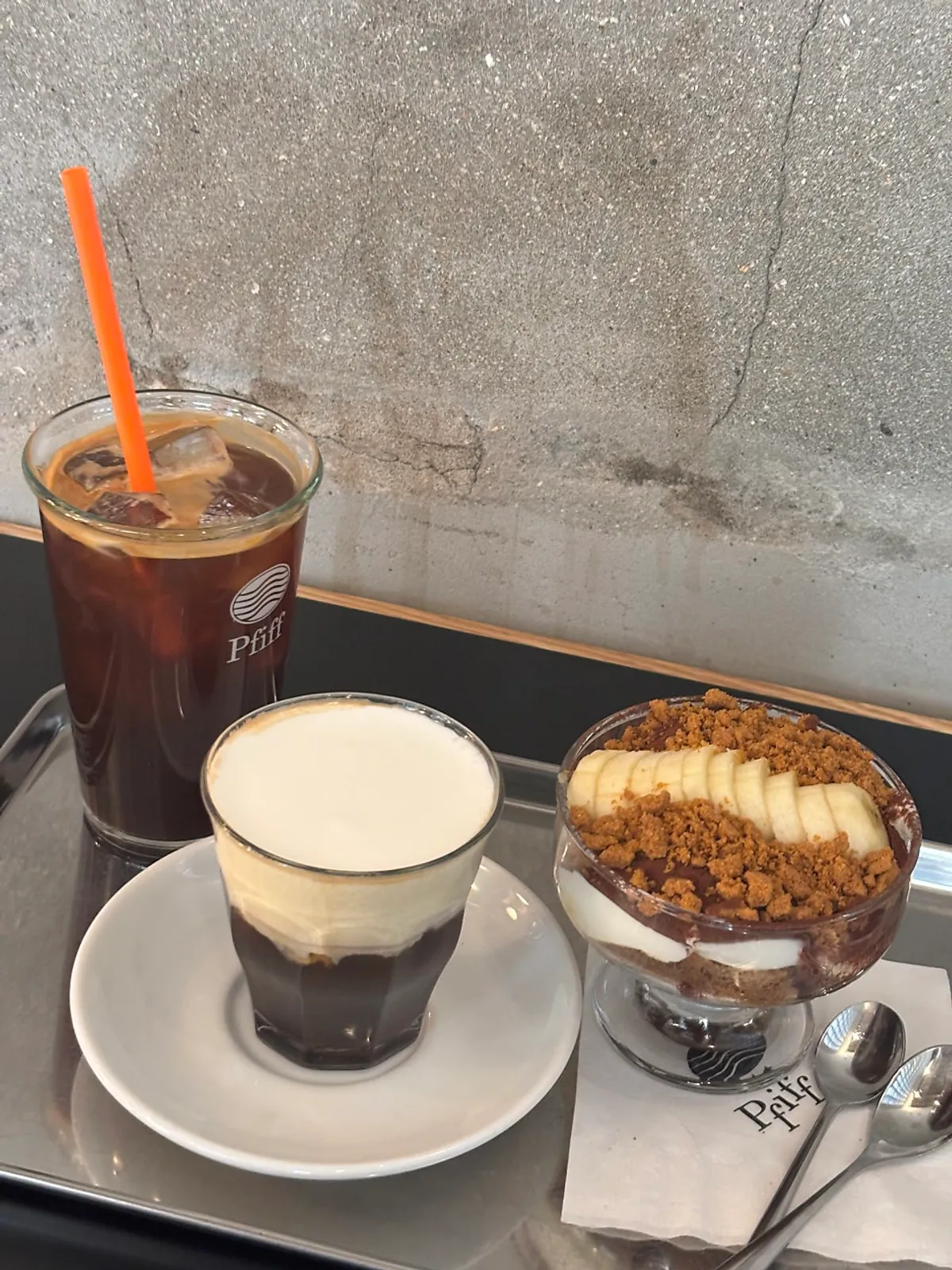 Table setting with Pip Coffee, iced Americano, and tiramisu banana crumble