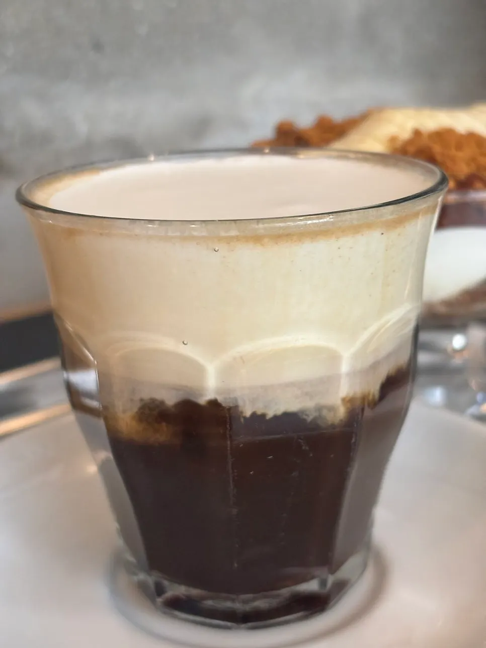 Pip Coffee cup showing espresso beneath the cream layer